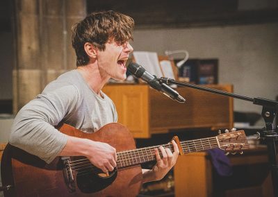 Singer playing guitar
